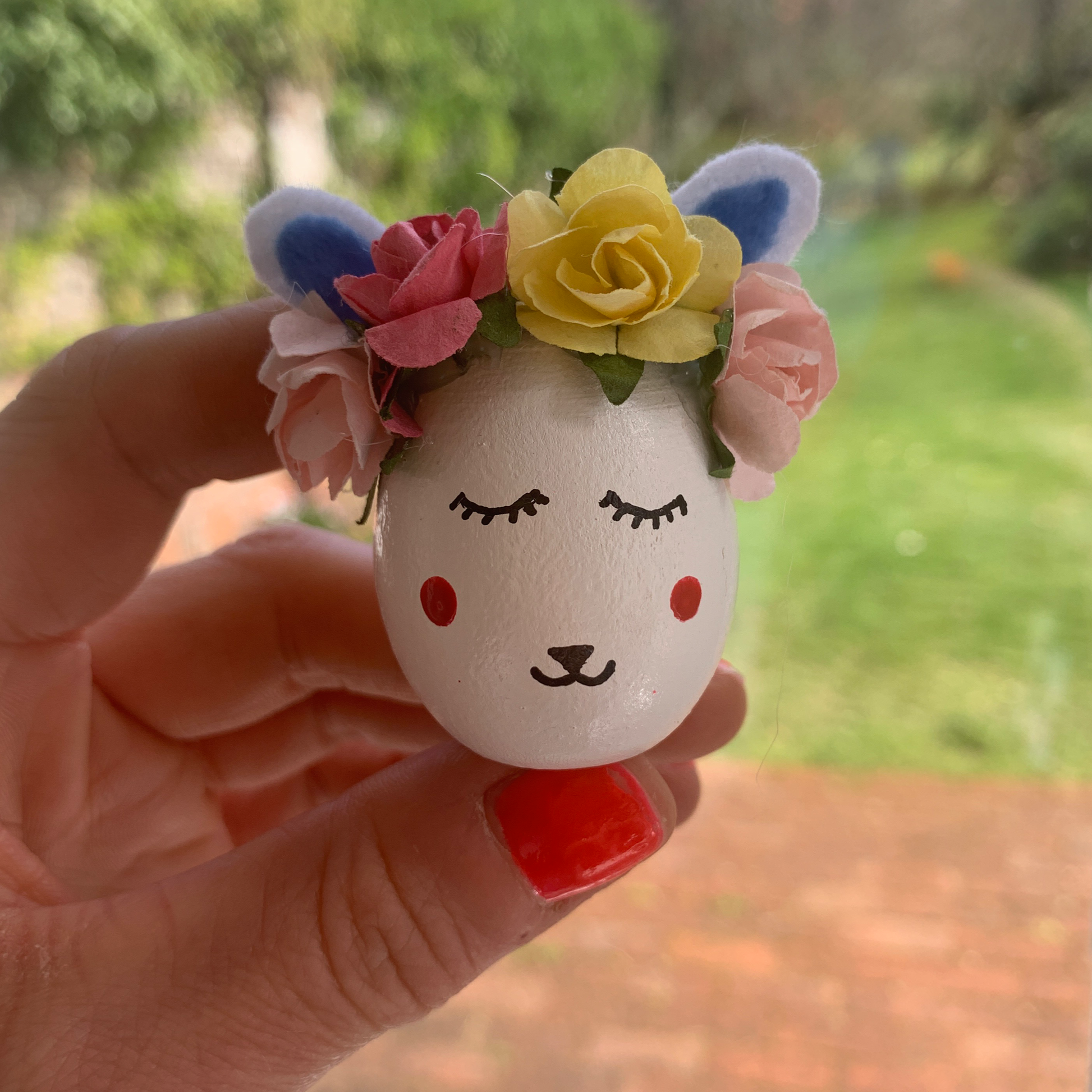 Individually painted wooden eggs with velvet ears, flower decoration and hand painted detailing.  Perfect for egg hunts, home decor or name place decorations for Easter lunches.  Approx 6cm tall.
