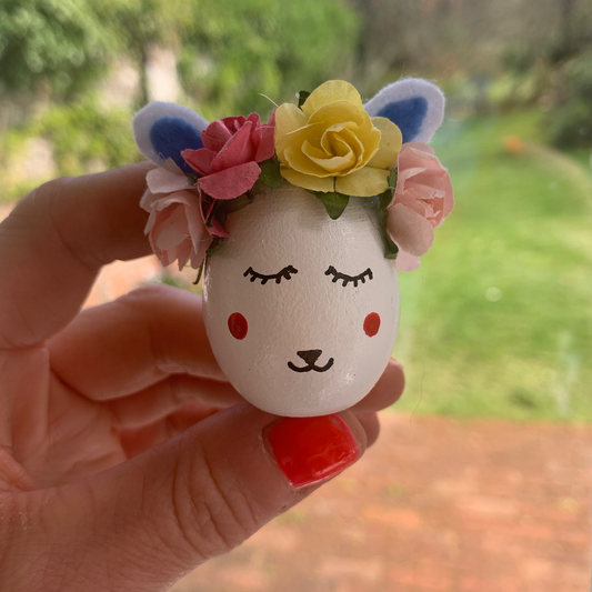Individually painted wooden eggs with velvet ears, flower decoration and hand painted detailing.  Perfect for egg hunts, home decor or name place decorations for Easter lunches.  Approx 6cm tall.